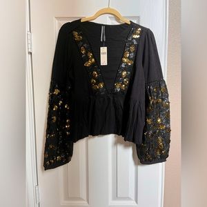 NWT anthro peplum blouse with embellished sleeves.
